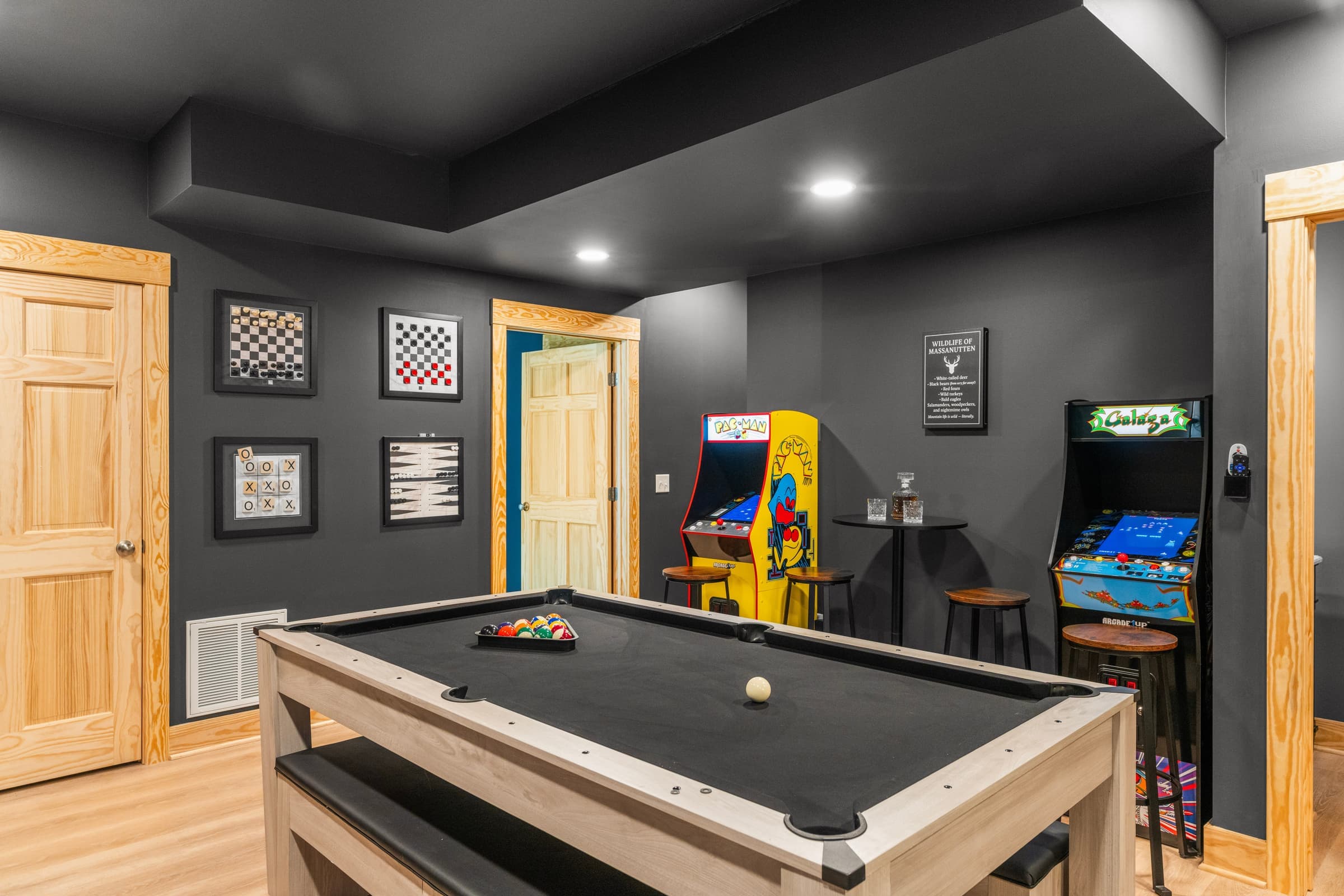 Game room with pool table and arcade